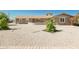 Landscaped front yard with gravel, shrubs, and a charming home at 8702 E Boise St, Mesa, AZ 85207