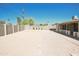 Large, open backyard with gravel and a partially visible home at 8702 E Boise St, Mesa, AZ 85207