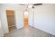 Well-lit bedroom with ceiling fan and ample closet space at 8702 E Boise St, Mesa, AZ 85207
