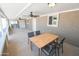 Covered patio with ceiling fan and outdoor dining set at 8702 E Boise St, Mesa, AZ 85207