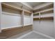 Walk-in closet featuring shelves and double hanging rods at 15817 W Bonitos Dr, Goodyear, AZ 85395