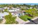 Aerial view of a house with a grassy yard and driveway, showcasing city views at 4307 N 15Th Dr, Phoenix, AZ 85015