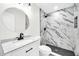 Modern bathroom with marble shower and updated vanity at 4307 N 15Th Dr, Phoenix, AZ 85015