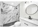 Modern bathroom with marble shower and updated vanity at 4307 N 15Th Dr, Phoenix, AZ 85015
