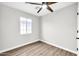 Well-lit bedroom with ceiling fan and wood-look flooring at 4307 N 15Th Dr, Phoenix, AZ 85015