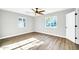 Spacious bedroom with two windows and hardwood floors at 4307 N 15Th Dr, Phoenix, AZ 85015