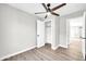 Bright bedroom with ceiling fan, closet, and wood-look flooring at 4307 N 15Th Dr, Phoenix, AZ 85015