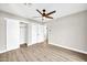 Bright bedroom with ceiling fan, large closet, and wood flooring at 4307 N 15Th Dr, Phoenix, AZ 85015