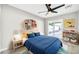 Cozy bedroom with blue bedding and built-in shelves at 4307 N 15Th Dr, Phoenix, AZ 85015