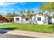 Newly renovated white single-story house with a yard at 4307 N 15Th Dr, Phoenix, AZ 85015