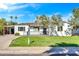 White single-story house with a grassy lawn and driveway at 4307 N 15Th Dr, Phoenix, AZ 85015