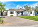 Charming white house with a landscaped yard and driveway at 4307 N 15Th Dr, Phoenix, AZ 85015