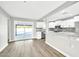 Remodeled kitchen features white cabinets, marble countertops, and stainless steel appliances at 4307 N 15Th Dr, Phoenix, AZ 85015