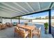 Outdoor patio with seating area, dining table, and pool view at 4307 N 15Th Dr, Phoenix, AZ 85015