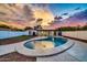 Backyard with a kidney-shaped pool, artificial turf, and a modern patio at 4307 N 15Th Dr, Phoenix, AZ 85015