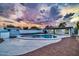 Backyard oasis featuring a kidney-shaped pool, storage shed, and artificial turf at 4307 N 15Th Dr, Phoenix, AZ 85015
