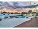 Kidney-shaped pool with surrounding patio and a storage shed at 4307 N 15Th Dr, Phoenix, AZ 85015