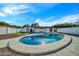 Kidney-shaped pool and spacious backyard with patio cover at 4307 N 15Th Dr, Phoenix, AZ 85015