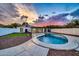 Modern backyard featuring a kidney-shaped pool and artificial turf at 4307 N 15Th Dr, Phoenix, AZ 85015