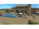 Luxury home with inviting pool, spa, and expansive patio perfect for outdoor entertaining at 10308 E Filaree Ln, Scottsdale, AZ 85262