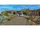 Stunning curb appeal with a paved driveway and desert landscaping at 10308 E Filaree Ln, Scottsdale, AZ 85262