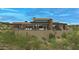 Modern home with a spacious backyard patio and beautiful mountain views at 10308 E Filaree Ln, Scottsdale, AZ 85262