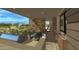 Covered patio with outdoor kitchen, dining area, and mountain views at 10308 E Filaree Ln, Scottsdale, AZ 85262