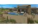 Relaxing backyard with a large pool, spa, and outdoor seating at 10308 E Filaree Ln, Scottsdale, AZ 85262