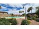 Relaxing community pool with surrounding landscaping at 6349 W Valencia Dr, Laveen, AZ 85339