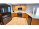Kitchen boasts stainless steel appliances and wood cabinets at 6349 W Valencia Dr, Laveen, AZ 85339