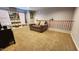 Spacious playroom with built-in shelving and seating at 6349 W Valencia Dr, Laveen, AZ 85339