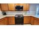 Modern kitchen features stainless steel range and microwave at 6349 W Valencia Dr, Laveen, AZ 85339