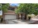 Two story home with attached garage and landscaping in front at 6349 W Valencia Dr, Laveen, AZ 85339