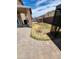Backyard with patio, grass, and storage shed at 6349 W Valencia Dr, Laveen, AZ 85339