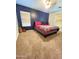 Bedroom with a queen bed and blue walls at 6349 W Valencia Dr, Laveen, AZ 85339