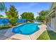 Inviting kidney-shaped pool with a painted wall backdrop at 4020 W Anderson Dr, Glendale, AZ 85308
