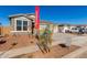 New construction home with a two-car garage and small front yard at 17826 W Blue Sky Dr, Surprise, AZ 85387