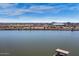 Aerial view of a large body of water with a city and sports stadium in the distance at 945 E Playa Del Norte Dr # 2008, Tempe, AZ 85288