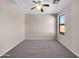 Well lit bedroom with carpet and window at 42054 W Cheyenne Dr, Maricopa, AZ 85138