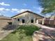 House exterior showcasing a well-maintained backyard and patio at 42054 W Cheyenne Dr, Maricopa, AZ 85138