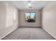 Spacious bedroom featuring a window and ceiling fan at 42054 W Cheyenne Dr, Maricopa, AZ 85138