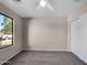Bright bedroom with carpet flooring and large window at 42054 W Cheyenne Dr, Maricopa, AZ 85138