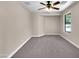 Bedroom with carpet flooring and ceiling fan at 42054 W Cheyenne Dr, Maricopa, AZ 85138