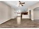 Open concept living room and kitchen area with a breakfast bar at 42054 W Cheyenne Dr, Maricopa, AZ 85138