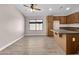Modern kitchen with wood cabinets, island, and new appliances at 42054 W Cheyenne Dr, Maricopa, AZ 85138