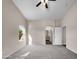 Spacious bedroom with carpet flooring and ceiling fan at 42054 W Cheyenne Dr, Maricopa, AZ 85138