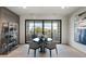 Elegant dining area with a modern table and access to a private balcony at 6431 N Lost Dutchman Dr, Paradise Valley, AZ 85253