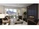 Living room with fireplace and sliding glass doors leading to a balcony at 18720 N 101St St # 3019, Scottsdale, AZ 85255