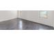 Simple bedroom with polished concrete floors and two windows at 35066 N Happy Jack Dr, San Tan Valley, AZ 85144