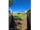 Large backyard with grassy area and gravel pathway at 35066 N Happy Jack Dr, San Tan Valley, AZ 85144